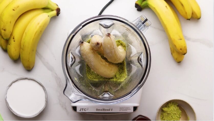 ground pistachios and frozen bananas in a blender