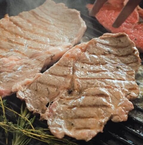 searing steak in cast-iron pan