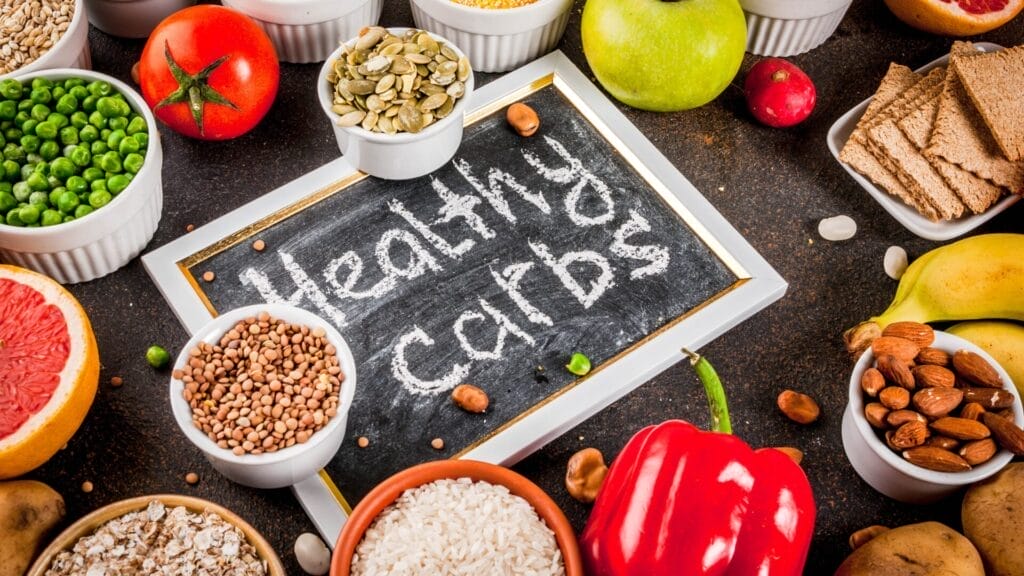 a chalkboard with various health carb foods on it