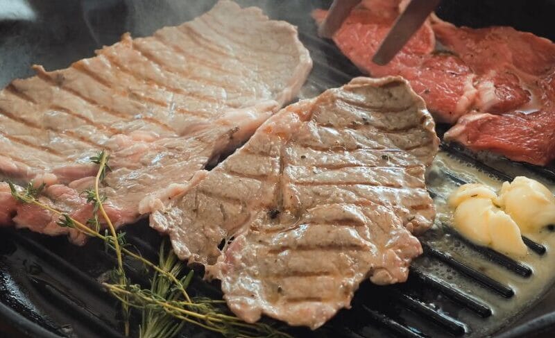 searing steak in cast-iron pan