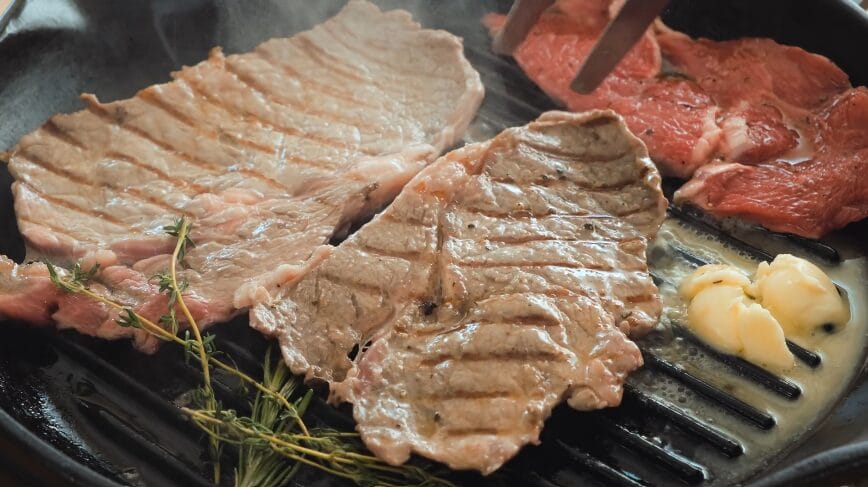 searing steak in cast-iron pan